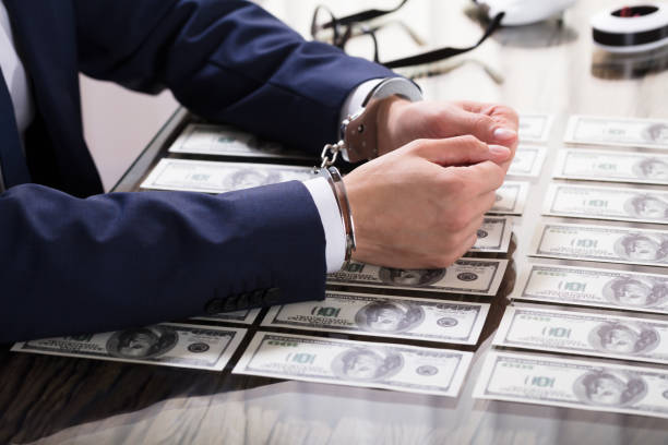 istock Businessperson In Handcuffs Arrested For Bribe 928078226