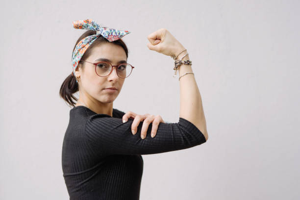 istock Young woman shows her strong arm 928080558