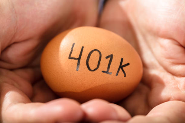 istock Human Hand With Egg With 401K Pension Text 928080750