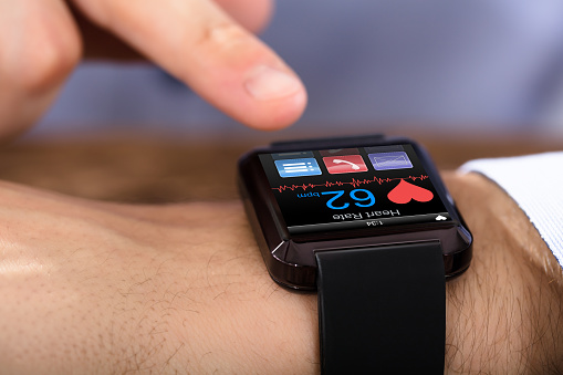 Person Hand Wearing Smart Watch Showing Heartbeat Rate