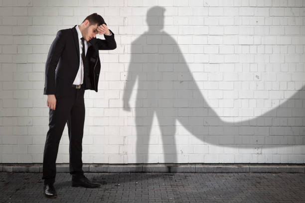 istock Tired Businessman With His Own Shadow In Cape 928081616