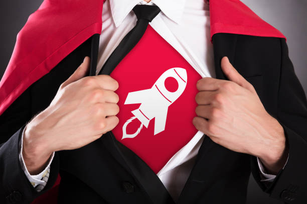 Businessman Opening Coat In Superhero Style