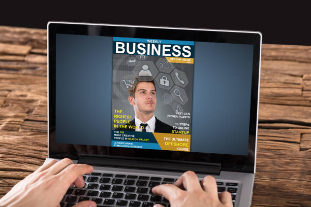 istock Person Looking At Magazine On Laptop 928081670