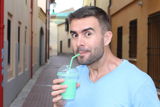 Man drinking vanilla milkshake.