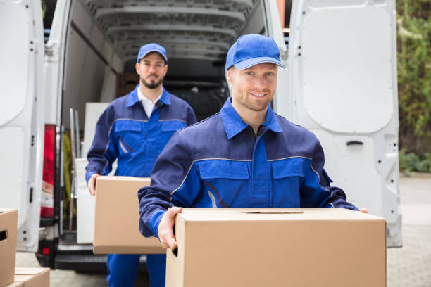 istock Close-up Of Two Delivery Men Carrying Cardboard Box 928084882