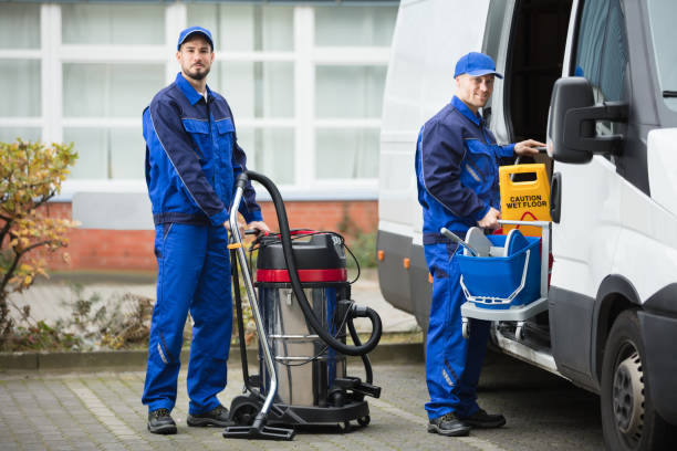 istock Two Male Janitor Unloading Cleaning Equipment From Vehicle 928085518