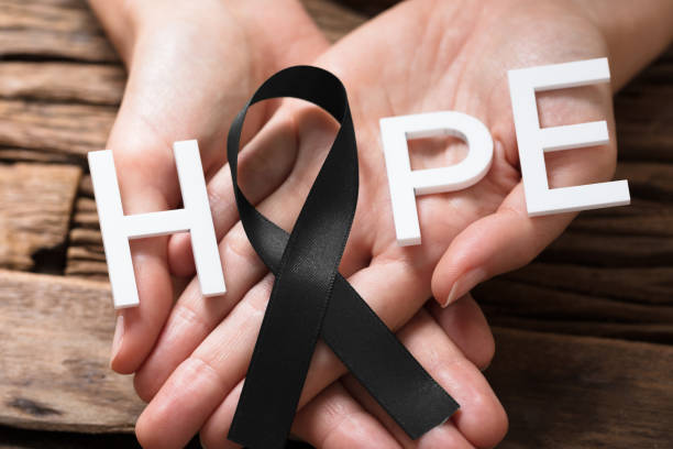 istock Hand Showing Ribbon With Hope Text 928087972