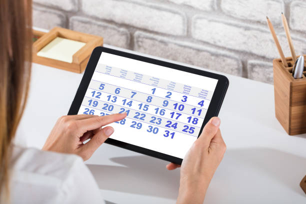 istock Businessperson Holding Digital Tablet With Calendar On Screen 928088444