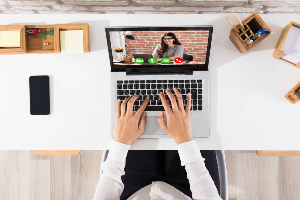 istock Elevated View Of Businessperson Videoconferencing On Laptop 928088468