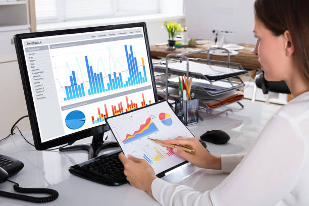 istock Businesswoman Checking Graph In Office 928088762