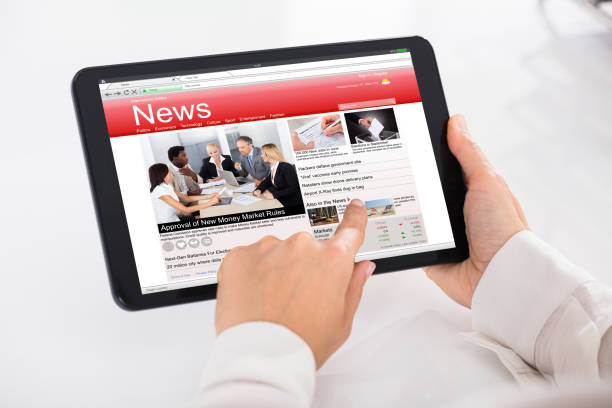 istock Person Reading News On Digital Tablet 928088826