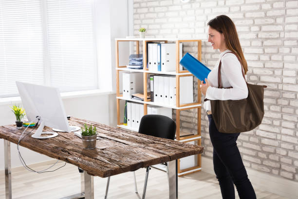 istock Businesswoman Walking In Office With Exercise Mat 928088870