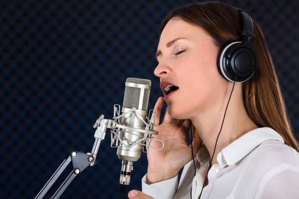 istock Young Woman Singer With Headphones 928088906