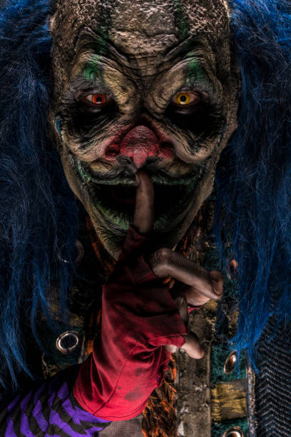 istock Creepy Clown with finger on lips 928089014