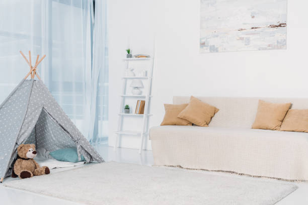 istock sofa with pillows and childish toys 928092288