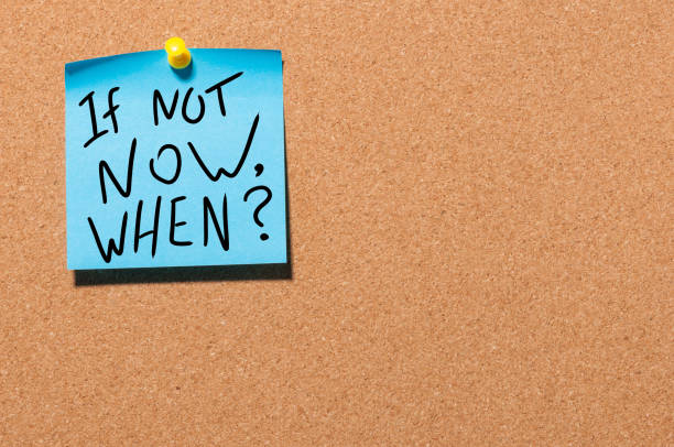 istock If Not Now, When Inspirational message pinned on office cork board 928092634