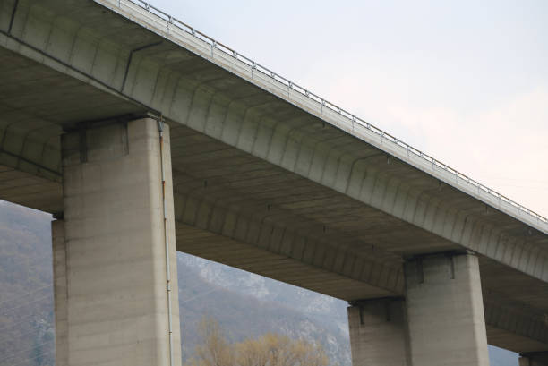 istock huge elevated viaduct with the highway that runs over the concrete pylons 928095184
