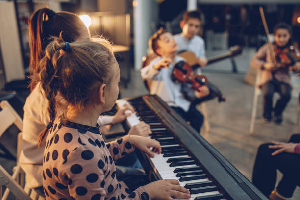 istock Teaching to play music in a youth orchestra 928095290