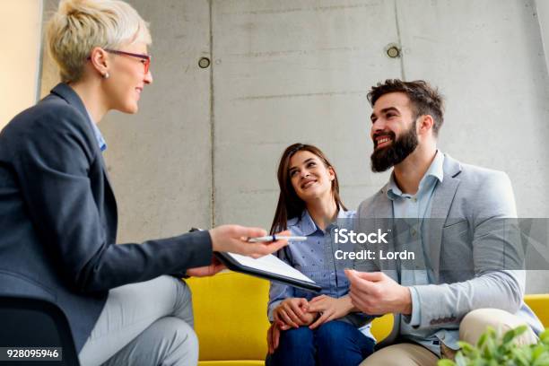 Young Married Couple At Their Counselor Stock Photo - Download Image Now - Real Estate Agent, France, Family