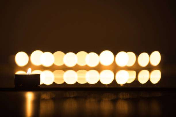 istock candle flames glowing in the dark. 928096010