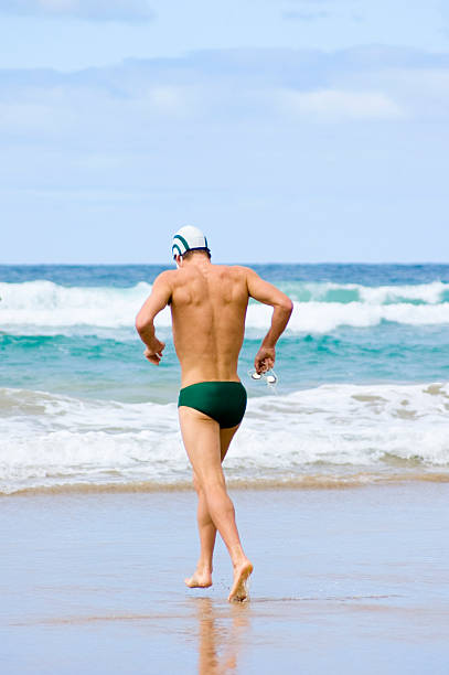 Jogging into the Surf stock photo