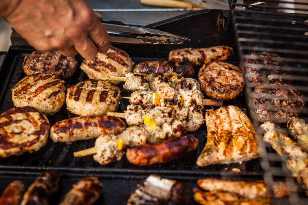 istock Gas barbecue with a variety on meat on it 928096606