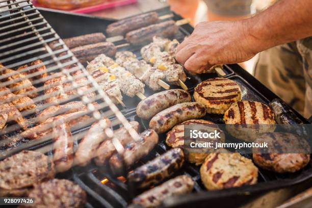 Gas Barbecue Cooking A Variety Of Meat Stock Photo - Download Image Now - Barbecue Grill, Barbecue - Meal, Burger