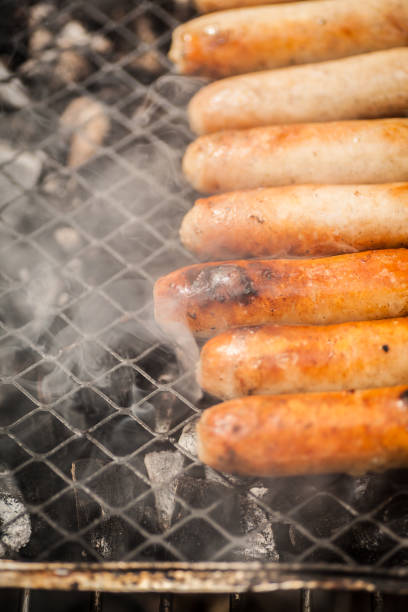 istock Disposable barbecue with meat cooking on it 928099762
