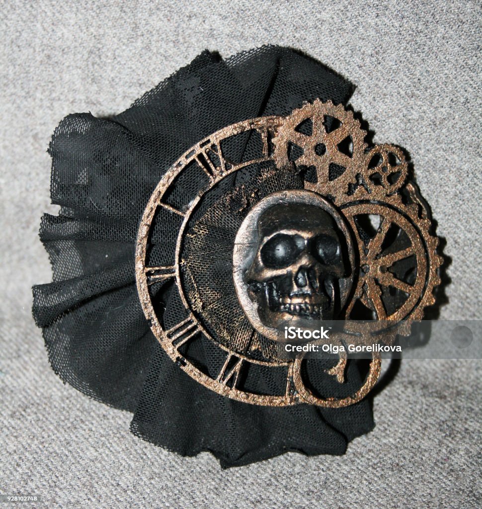 Handmade steampunk brooch with a skull, bronze decorative elements and black lace Ancient Stock Photo