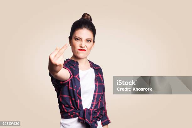 Middle Finger Sign Unhappy Angry Young Woman Showing Middle Finger With Unsatisfied Face Stock Photo - Download Image Now