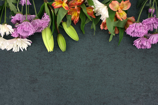 Beautiful Colorful Flowers Bouquet Border Shot From Directly Above Over Black Dark Texture Background, Horizontal
