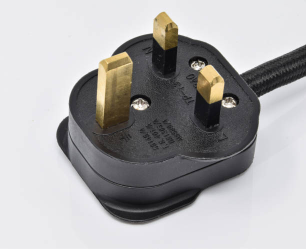 Close up of a UK three pin electric plug Close up of a UK three pin electric plug three pin plug stock pictures, royalty-free photos & images
