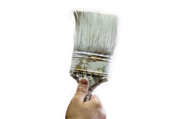 istock Hand holding an old paint brush 928110966