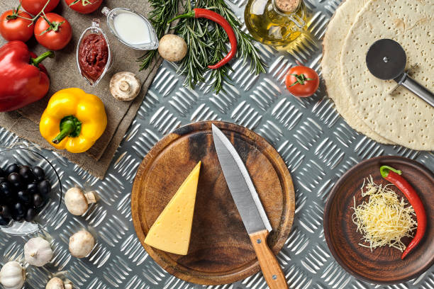 istock Cheese, different vegetables on metal table. Ingredients for traditional italian pizza 928114512