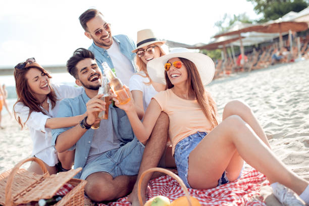 istock Young friends enjoying a beach party 928115592