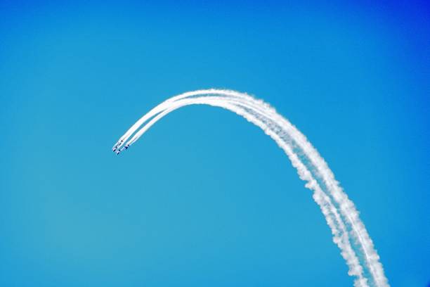 istock Low Angle View Of Airplane Flying Against Clear Blue Sky 928116552