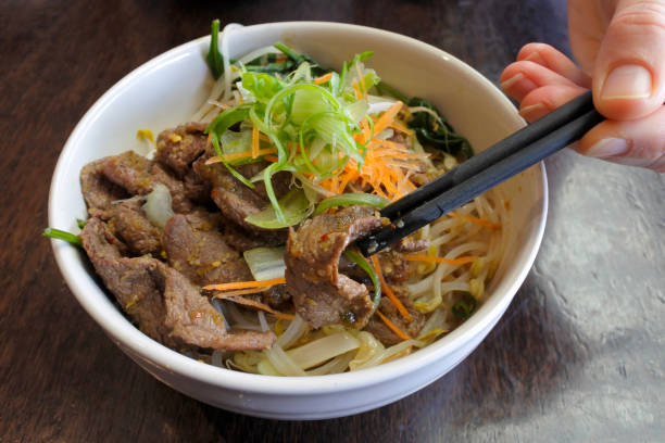 Chilli beef dish served in a bowl. Japanese food background and texture. Copy space.