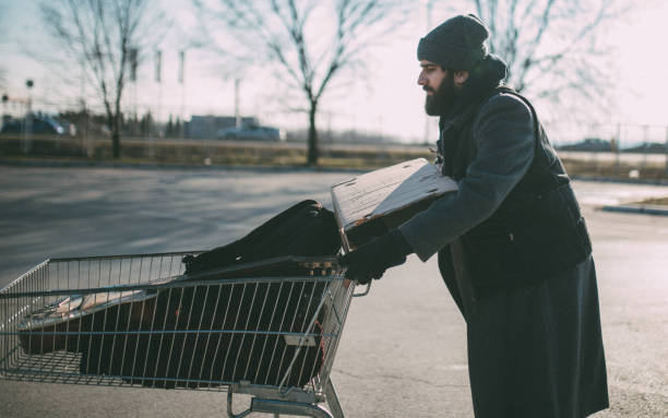 istock Homeless pushing shopping cart 928120156