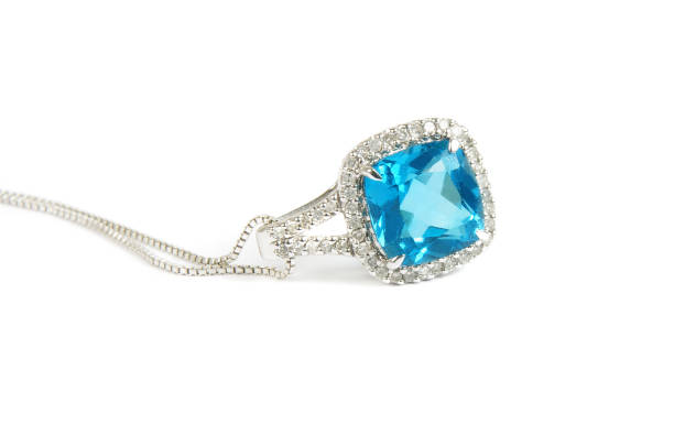 istock Close-Up Of Blue Gemstone Pendant With Chain Against White Background 928120972
