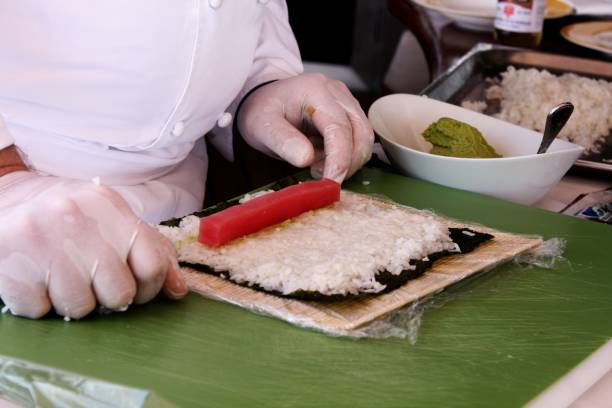 istock Midsection Of Man Preparing Food On Table 928124602
