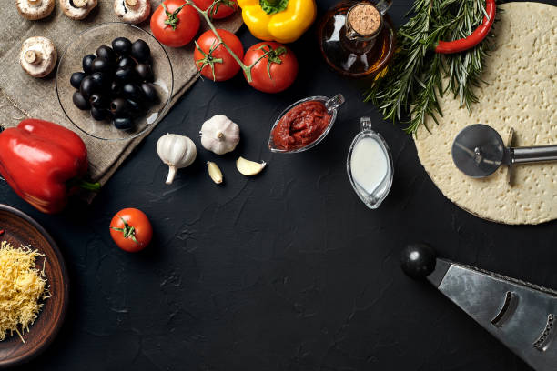 istock Pizza cooking ingredients. Dough, vegetables and spices. Top view with copy space 928125752