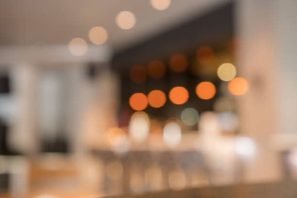 istock Blurry image of a cafe interrior background with bokeh 928126742