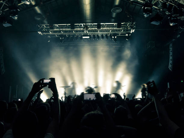 istock Concert crowd in front of a live stage 928126890