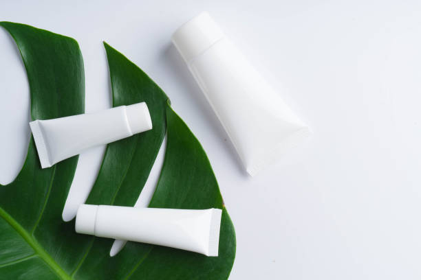 istock Beautiful natural cosmetics and leaves on light background 928143176