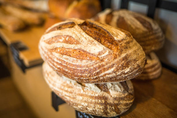 istock Organic Miche bread on shelf fresh baked 928145778