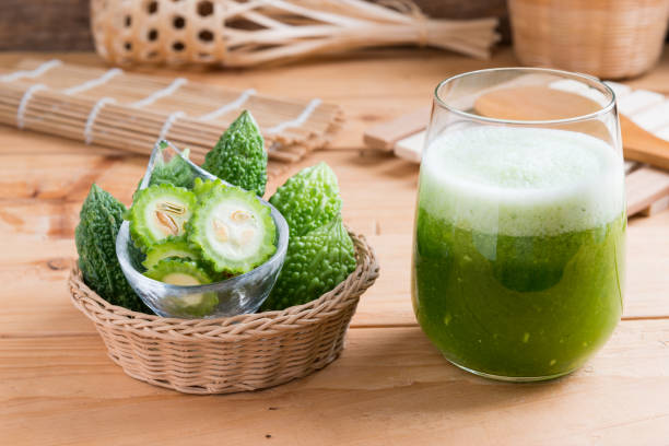 Herbal juice of green momodica , Balsam apple, Balsam pear, Bitter cucumber , Bitter gourd stock photo