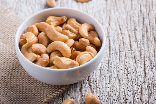 istock Roasted cashew nuts on rustic wood 928153158