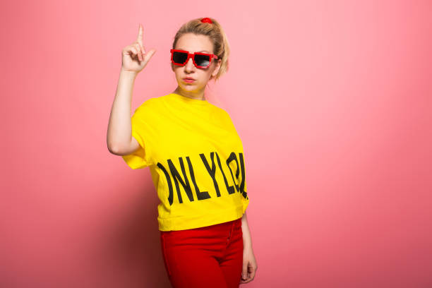 istock Blonde woman in bright clothes 928153402