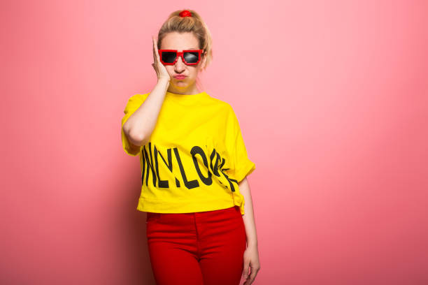 istock Blonde woman in bright clothes 928153490