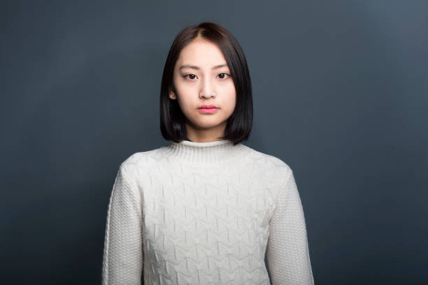молодая азиатская женщина,портрет - teenage girls studio shot looking at camera waist up стоковые фото и изображения